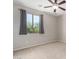 Bedroom with carpeted floor, ceiling fan and window with gray curtains at 12759 W Eagle Ridge Ln, Peoria, AZ 85383