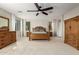 Main bedroom with ceiling fan and large wood dresser at 12759 W Eagle Ridge Ln, Peoria, AZ 85383