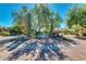 Circular community entrance with cacti and a bench at 12759 W Eagle Ridge Ln, Peoria, AZ 85383