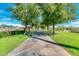 Paved pathway with lush landscaping leading to community amenities at 12759 W Eagle Ridge Ln, Peoria, AZ 85383