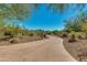 Paved path meanders through desert landscaping at 12759 W Eagle Ridge Ln, Peoria, AZ 85383