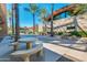 Community patio with tables, chairs, and shade structures at 12759 W Eagle Ridge Ln, Peoria, AZ 85383