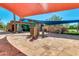 Stone patio area with shade sails and a water feature at 12759 W Eagle Ridge Ln, Peoria, AZ 85383