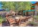 Relaxing community patio with seating, fire pit, and shade trees at 12759 W Eagle Ridge Ln, Peoria, AZ 85383