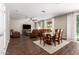 Bright dining room features hardwood floors, and a view into the living room at 12759 W Eagle Ridge Ln, Peoria, AZ 85383