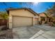 Tan two-story house with a three-car garage and walkway at 12759 W Eagle Ridge Ln, Peoria, AZ 85383