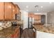 Modern kitchen with granite countertops and stainless steel appliances at 12759 W Eagle Ridge Ln, Peoria, AZ 85383