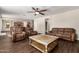 Living area with leather sofas and view into dining area at 12759 W Eagle Ridge Ln, Peoria, AZ 85383