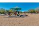 Community playground with shaded play structures and swings at 12759 W Eagle Ridge Ln, Peoria, AZ 85383