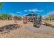 Community playground with shade structure, slides, and climbing equipment at 12759 W Eagle Ridge Ln, Peoria, AZ 85383