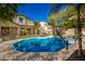 Sparkling pool in a large backyard with a basketball hoop at 12759 W Eagle Ridge Ln, Peoria, AZ 85383