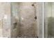 Walk-in shower with pebble floor and glass enclosure at 12759 W Eagle Ridge Ln, Peoria, AZ 85383