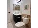 Clean bathroom with toilet and dark vanity at 1302 E 30Th Ave, Apache Junction, AZ 85119