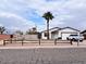 Single-story home with a well-maintained front yard and split-rail fence at 1302 E 30Th Ave, Apache Junction, AZ 85119