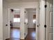 Bright hallway with doors to bedrooms and closets at 1302 E 30Th Ave, Apache Junction, AZ 85119