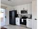 Modern kitchen with stainless steel appliances and white cabinets at 1302 E 30Th Ave, Apache Junction, AZ 85119