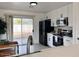 Modern kitchen with stainless steel appliances and white cabinets at 1302 E 30Th Ave, Apache Junction, AZ 85119