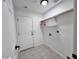 Bright laundry room with built-in shelving at 1302 E 30Th Ave, Apache Junction, AZ 85119