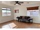 Living room with hardwood floors and large windows offering natural light at 1302 E 30Th Ave, Apache Junction, AZ 85119