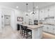 Bright kitchen with white cabinetry, a center island, and seating, perfect for entertaining at 1332 E Sierra Vista Dr, Phoenix, AZ 85014