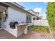 Outdoor grill and a well-manicured lawn provide the perfect outdoor living experience at 1332 E Sierra Vista Dr, Phoenix, AZ 85014