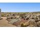 Landscaped desert backyard with large boulders and native plants at 13512 N Granite Way, Fountain Hills, AZ 85268