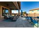 Backyard patio has an outdoor seating area, a grill and a nice pool area at 13855 S 181St Ave, Goodyear, AZ 85338