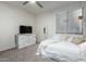 Bedroom featuring a bed, a television and carpeted floors at 13855 S 181St Ave, Goodyear, AZ 85338