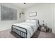 Bedroom featuring a bed, a nightstand and carpeted floors, providing a cozy and inviting atmosphere at 13855 S 181St Ave, Goodyear, AZ 85338