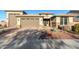 Charming single-Gathering home with a three-car garage and a well-maintained, xeriscaped front yard at 13855 S 181St Ave, Goodyear, AZ 85338