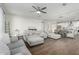 Bright and airy living room with hardwood floors seamlessly connected to dining area at 13855 S 181St Ave, Goodyear, AZ 85338