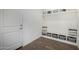 A well-organized mudroom features bench seating and cubbies for storage at 13855 S 181St Ave, Goodyear, AZ 85338