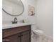 Modern bathroom with dark vanity and patterned floor at 1413 N Sunview Pkwy, Gilbert, AZ 85234