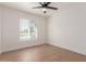 Light and airy bedroom with a window and ceiling fan at 1413 N Sunview Pkwy, Gilbert, AZ 85234