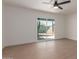 Serene bedroom with sliding door access to the backyard patio at 1413 N Sunview Pkwy, Gilbert, AZ 85234