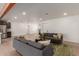 Bright living room with comfy sofas, coffee table, and wood-look flooring at 1413 N Sunview Pkwy, Gilbert, AZ 85234