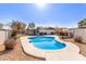 Inviting kidney shaped pool with a pergola in the backyard at 1413 N Sunview Pkwy, Gilbert, AZ 85234