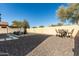 Relaxing backyard with patio furniture and gravel at 15446 W Montecito Ave, Goodyear, AZ 85395