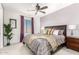 Bright bedroom with a king-size bed and nice window coverings at 15446 W Montecito Ave, Goodyear, AZ 85395