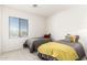 Bright bedroom with two twin beds and large window at 15446 W Montecito Ave, Goodyear, AZ 85395