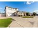 Two-story house with a landscaped yard and driveway at 15446 W Montecito Ave, Goodyear, AZ 85395