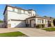 Two-story house with a three-car garage and front yard at 15446 W Montecito Ave, Goodyear, AZ 85395