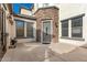 Front entrance with stone accents and a gray door at 15446 W Montecito Ave, Goodyear, AZ 85395