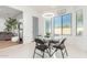 Kitchen breakfast nook with glass table and four chairs at 15446 W Montecito Ave, Goodyear, AZ 85395