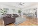 Open concept living room with hardwood floors and a view of the kitchen at 15446 W Montecito Ave, Goodyear, AZ 85395