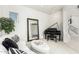 Elegant living room with a grand piano and a white couch at 15446 W Montecito Ave, Goodyear, AZ 85395