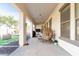 Covered patio with seating area and desert landscaping at 15446 W Montecito Ave, Goodyear, AZ 85395