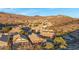 Aerial view of homes in a mountainside community with pools and desert landscape at 15632 S 6Th St, Phoenix, AZ 85048