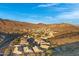 Aerial view showcasing a neighborhood with mountain views and numerous houses at 15632 S 6Th St, Phoenix, AZ 85048