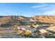 Aerial view of a luxury community nestled in the mountains with stunning desert landscape at 15632 S 6Th St, Phoenix, AZ 85048